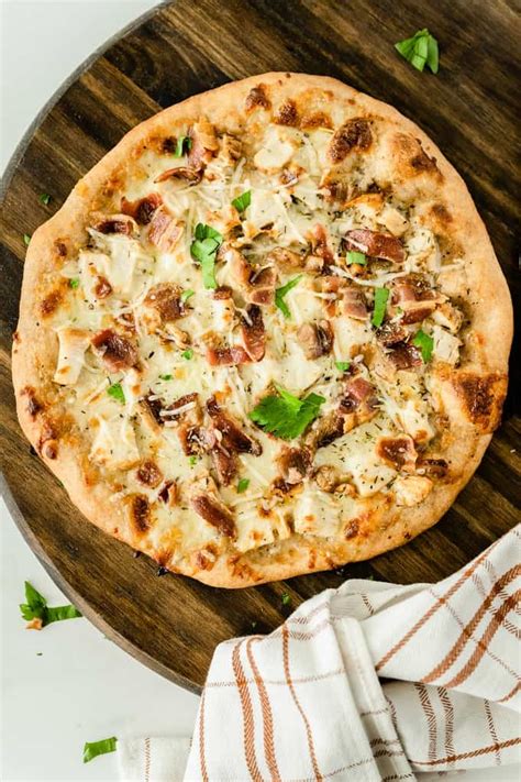 Ceaser pizza - Add 1 cup (245 G) of Caesar dressing to the. chicken and mix together. Let simmer on low heat. Turn dough out of the bowl and roll it into a circular shape for the pizza. Place on …